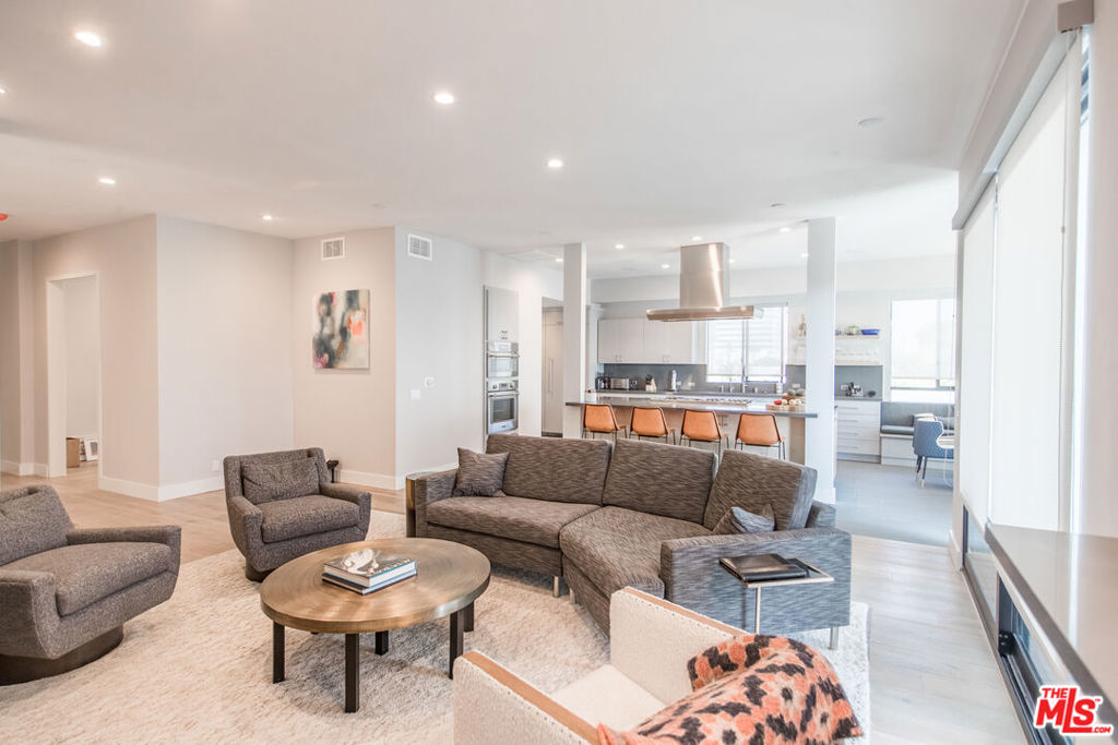 This stunning and completely remodeled 4,000+ square feet top floor penthouse unit is one of the largest and most luxurious offerings in this market. The unit is a 4 bedrooms/5 bathrooms apartment with two floors and a 360-degree private rooftop deck that includes a private gym/recreational room. The unit comes fully equipped with a gourmet kitchen with top-of-the-line Thermador stainless steel appliances including a double wall oven, warming dish drawer, gas range stove, double-width refrigerator and freezer, and large wine cooler. The kitchen has a custom built-in breakfast nook with ample seating and storage with a large kitchen island ideal for entertaining. The large open living room has an electric fireplace, a sliding glass door to a private balcony as well as a wet-bar area next to a large private dining room and walk-in pantry closet. The primary bedroom is connected to a large walk-in closet as well as an ensuite bathroom with custom tiling, a free-standing tub, a steam glass shower, and a privacy glass water closet with imported fixtures. There is a large home office room with built-in cabinetry and ample lighting for an ideal work-from-home setup. In addition, the unit boasts two powder rooms for guests with vanities and custom tiling, tons of storage closets, and is equipped with surround sound and a security alarm system. The unit comes with central heating and central air conditioning, a laundry room with built-in cabinetry, and top-of-the-line washer and dryer appliances. The is unit has its dedicated trash chute and a private key-locked elevator entry into the unit. The building has all new windows, a new lobby, new hallways and carpet, a new elevator, and comes with tandem gated garage parking with storage above the parking spot.