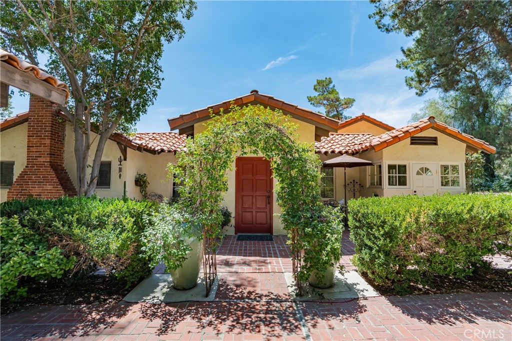 Experience a one-of-a-kind home in Lake Elsinore's Country Club Heights, a community with a legendary past. This California Ranch-style home, part of a development by Jackie Coogan (of The Addams Family), was a party hub for Hollywood's Golden Age, hosted by star Toby Wing. It's said that legends like Bob Hope, Mae West, and Fred Astaire once gathered here. Today, this private sanctuary has been meticulously updated for a modern lifestyle. A long, 180-foot widened driveway and new retaining wall ensure privacy, leading to a home that blends historic charm with a long list of modern upgrades. You’ll find new wood flooring in the dining area and vintage tile in the kitchen, along with an updated electrical panel, new oversized hot water heater, copper water lines, and an HVAC system with mini-splits. The master suite features a beautiful stone fireplace, while a new loft and front entry add valuable square footage. Enjoy the spectacular lake views from any of the three decks. The garage and extra large A-frame carport both have new roofs, and the home has a large crawl space for ample storage. Most windows and doors are double-pane, and the shutters, blinds, and shades come with a lifetime guarantee. There is also a detached workshop, detached gardening shed and 2 large mini-splits to add even more comfort throughout the home. This home offers a rare opportunity to own a piece of history, perfectly updated for your own rockstar lifestyle. Schedule a private showing to feel the magic of this unique property.