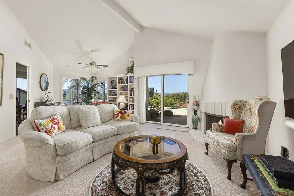 This well-maintained single-story home is located in the gated Chapala community of Oaks North, a 55+ neighborhood in Rancho Bernardo. Positioned on the bluff, it captures beautiful mountain and golf course views. The home’s thoughtful layout features vaulted ceilings in both the great room and primary suite, offering an open sense of space. The spacious primary suite features a skylight, abundant closet space, and patio that’s perfect for relaxing. The second bedroom can double as an office, complete with built-in shelving, a desk, and direct access to the hall bath for added convenience. Practical updates include a replaced roof, furnace/AC, water heater, water softener. Additional highlights include an indoor laundry in closet, an attached two-car garage, solar panels with battery backup, and Meyer lemon tree that adds a touch of charm to the backyard. Ideally close to the Rancho Bernardo Winery and Oaks North Golf Course, this home offers a comfortable and easy-care lifestyle!