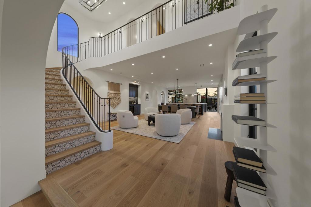 Artful, lavish and precious rarity all synthesized to create this flawless masterpiece. Introducing a one-of-a-kind executive residence beaming bespoke craftsmanship and innovative sophistication. This new construction architecture pays homage to Kensington’s legacy with a brilliant Spanish design. The main house is a work of art, but not at the expense of function and livability. Every facet of daily life has been accommodated, all the while meticulously aligning with modern day contemporary precision. The fixtures, materials and details have created transcendent value. Add to that the perfectly appointed guest home, which is spacious and nothing short of pure inspiration. It doesn’t stop there, because the verandas, gardens and ensuing privacy are the ultimate calling card for the discerning connoisseur looking for that quiet luxury experience. *See Supplement for Details* The main residence boasts approximately 3000sf of timeless refinement. Extensive thought has been given to even the smallest design curve, flooring selection, wall finish, lighting and optimal window placement. Predominantly new construction, there are only a few areas of original front and side wall/roof framing remaining. The infrastructure boasts completely new plumbing, electrical and sewer to the street. The house features MARVIN Windows, FLEETWOOD Sliders, LUTRON Lighting, MIRAGE engineered Hardwood Floors, FITTES integrated air vents, the list goes on and on and on… Let’s make a visit into the kitchens of dreams. I mean, are you ready to take a culinary journey into elevated gastronomy? Well, here is the ultimate launching ground for such a trip since you have both MAIN and PREP Kitchens. This kitchen truly sets the standard for timeless functional intelligence, as well as a sleek presentation. All expectations are achieved, be it the SUBZERO refrigeration, WOLF 60” range with double oven and French cooktop, two MIELE dishwashers or exquisite QUARTZITE natural stone countertops. The 11ft+ Island feels dramatic and defining. The auxiliary PREP Kitchen offers a wine fridge, freezer drawers, its own dishwasher and speed oven with microwave, a party ready SCOTSMAN pellet ice maker, coffee station and an Instagram Selfie worthy bar! In a home full of highlights, the centerpiece of the home is arguably the dramatic staircase! Framed by spectacular windows, custom designed iron railing, limestone tile risers with MIRAGE treads, it is topped off with a “MOMA” quality RH Chandelier perched royally over an open two- story light drenched atrium. The main living areas are all transitional open concept rooms with sight lines directly from the front of the home, straight through the custom EUROLINE steel and glass doors and windows, out to the gardens. There is no facet of day to day living that hasn’t been considered. The design has integrated bedrooms on both floors, stunning baths, a dog bath, mud room, full laundry room (including ROOMBA Vacuum), an office and/or nursery, and to top it all off is the primary suite you’ve been searching your whole life for. The suite starts with a beautiful wardrobe featuring a CALIFORNIA CLOSET custom walk-in closet system. The bedroom itself is grand in stature and enjoys rooftop views leading out to the balcony. The lighting, blackout drapes and cabinetry will exceed your expectations. But that’s not all - step into the sleek primary bath. Once again, Quartzite natural stone, Kallista shower fixtures, a sumptuous freestanding BLU Bathworks bathtub and a refined potpourri of flooring, lighting and wall tiles take the stage. The guest house is also new construction boasting a separate address and power meter. The kitchen and island are better than most regular home kitchens. The forms, fixtures and materials are all consistent with the main house quality. Between the main house and guest house are the gardens. Manicured and cultured, there is room for a pool, spa or other recreational addition. Multiple electrical accommo...