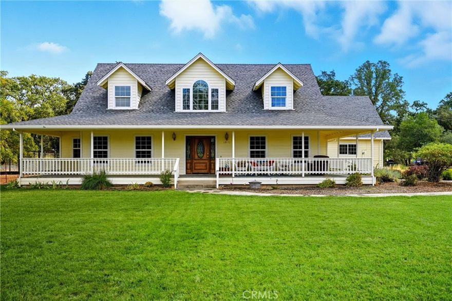 Welcome to this inviting custom built home with a classic front porch that wraps around to the sides of the house, perfect for enjoying morning coffee or evening sunsets. Inside, the main level offers a spacious layout with abundant natural light. The large kitchen features ample counter space and dining area. The generously sized back patio is accessible from the living room and the primary suite. The main-floor primary suite is designed for comfort, with a two-person tiled shower, double sinks with tile countertops, a privacy closet, walk-in closet, and a sliding door to the patio. A ground floor study with built-in bookshelves has a door to the side porch. A family room with cathedral ceilings, family room, and a laundry room and half bath complete the first floor. Upstairs over the garage is a private bedroom with partial bath (shower and toilet, no sink) and its own ductless mini-split for heating and cooling—ideal for guests or extended family. Over the main house on the second floor are 2 bedrooms, each with a dormer window (and one of those dormer windows has a window seat), and a full bathroom. Outdoors, enjoy a large grassy front yard with automatic sprinklers, a large fenced garden area in the backyard, and plenty of space for entertaining. A propane-powered whole house generator automatically switches on to ensure peace of mind during power outages. Milgard windows throughout are among the many upgrades in this custom home. The roof was replaced in late 2024. Some of the photos have been digitally staged. This home blends charm, function, and comfort.