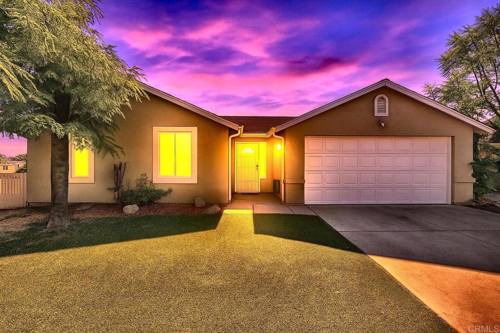 This single-level 3 bedroom, 2 bath home offers 1,452 sq. ft. of thoughtfully designed living space. Built in 2002, it provides the peace of mind of newer construction without the compromises of a condo or HOA. Features include 9 ft. ceilings, an open-concept layout, a living room fireplace, central heat & A/C, and a whole house fan. Fresh paint inside and out enhances the bright, welcoming feel. The large primary suite has two walk-in closets, while the kitchen is upgraded with granite countertops, soft-close cabinets, and under-cabinet lighting. Tucked off the street for privacy, the exterior offers a low-maintenance artificial lawn, a mature shade tree, an attached 2-car garage, extra parking, and a storage building. The fenced side yard is perfect for a garden or dog run, while the smaller, easy-to-manage backyard is waiting for your vision to make it your own. Conveniently located near shopping, dining, transit, and freeway access. A great opportunity to own a newer single-family home with no HOA fees.