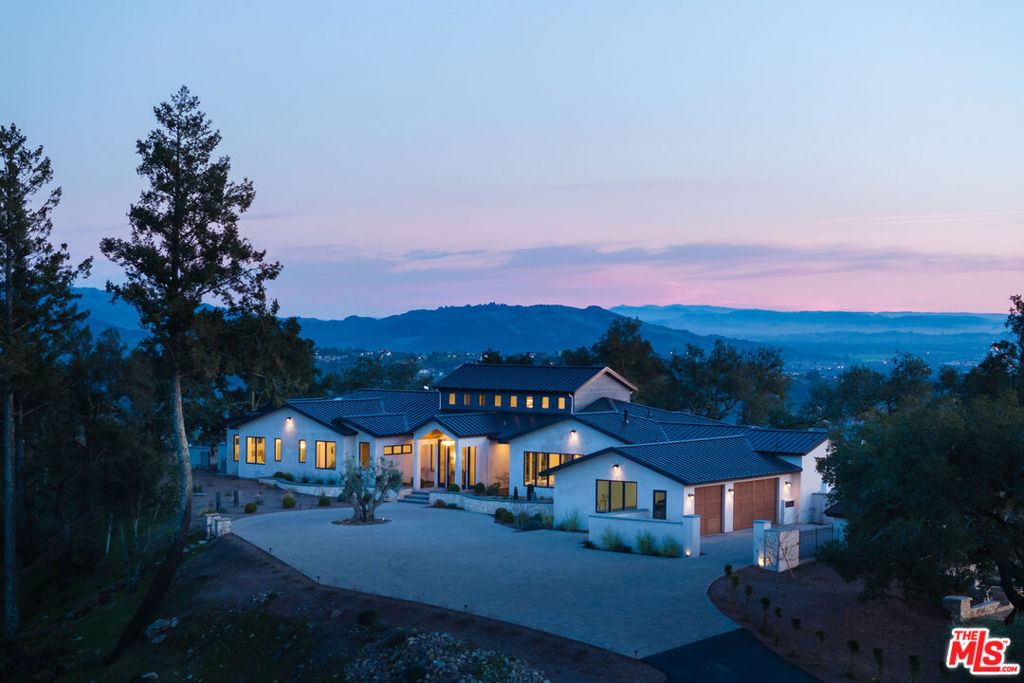 Redwood Hill RetreatA breathtaking new Sonoma County estate beckons from its lofty hilltop, promising a life of ease in harmony with nature. To ease your options for owning this paradise the seller is offering Seller Financing. Glide up the long driveway, past gnarled old olive trees, where graceful oaks frame 360-degree views across just over 57 acres. The scent of chaparral mingles with birdsong, gracing your mornings with tranquility.Step through the monolithic entry, past rugged limestone walls, and into a home designed to embrace the healing vistas that surround it. Walls of glass open wide, merging indoor and outdoor living with mature gardens and sun-soaked covered galleries. Designed to capture both the breeze and the sunlight, the home radiates warmth. In the great room, a towering stone fireplace rises two stories to lofty cedar-clad ceilings, dappled with light from clerestory windows and elegant designer fixtures. Smooth French Oak floors lie invitingly beneath your bare feet.The covered outdoor living spaces are as welcoming as those inside. Sink into deep couches with a glass of Sonoma's finest vintage, chosen from your glass wine cellar, as you take in the epic sunsets. The cozy family room offers a choice between the warmth of a toasty fireplace and the breathtaking views beyond its walls of windows. No expense was spared in the sublime kitchen, where two matching islandsone for prep, one for gatheringprovide both function and beauty. A full wall of glass opens here as well, ensuring seamless access to the outdoors. Gaggenau appliances will inspire the chef in you, while clean Quartzite counters contrast elegantly with the warmth of custom cabinetry. An office/media room offers a retreat when you need to reconnect with the world.The serene primary suite is a sanctuary of luxury. Stone walls, a stone-faced fireplace, and doors to a private patio connect you to the landscape. Indulge in the vast en suite bath, where a deep soaking tub and a striking Nero Marquina marble shower capture views of distant hills.Three additional bedroom suites welcome guests to your private oasis. Entertain in style. A large entertainment terracecomplete with a covered pool pavilion with a bar, TV, and fireplaceoverlooks the far end of the soulful limestone pool. A full guest house with kitchen, living room, and bedroom suite sits above, with views of forever. The outdoor kitchen, with a built-in barbecue and pizza oven, sets the stage for unforgettable celebrations. Nearby, the rhythmic click of bocce balls fills the air. Rinse off the dusty trails in the open-air shower, then relax in the bubbling hot tub, soothing muscles well-used from hiking, riding, or golfing nearby. A Savant Smart Home System ensures effortless living.The estate invites your visionperhaps a garden, a vineyard, or equestrian stables. The motor court faces a three-car garage, with an extra 2 car garage beneath the guest house, with ample parking for a true gala.This is Wine Country. Surrounding towns boast exquisite restaurants and wineries, the birthplace of farm-to-table cuisine. Entertainment aboundsart galleries, theaters, live music, craft cocktail bars, and cozy pubs create a vibrant social scene. Sonoma County spans redwood forests, the stunning Northern California Pacific coast, rolling mountains, and more than 50 parks, where trails lead to blissful discoveries.Here, you unplug and unwind. A perfect second home, just a short distance from San Francisco and its airports, this is the California Dream realized. Once here, you may never want to leave.