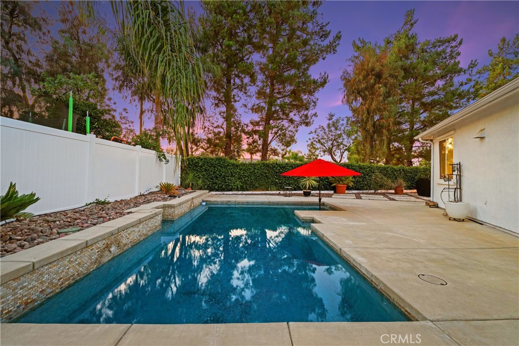 SINGLE STORY POOL HOME ON A 1/4 ACRE LOT IN HARVESTON! Welcome to 28834 Lexington Road – a truly one of a kind property in Temecula’s highly sought after Harveston community. Set on a generous quarter acre lot, this single-story stunner combines privacy, elegance, and unmatched community amenities. Inside, you’ll find strong bones and true pride of ownership throughout. Gorgeous luxury vinyl plank flooring is accented by 5.5-inch baseboards, while soaring 10 foot ceilings create an airy, open feel in every room. The gourmet kitchen is a chef’s dream, boasting high end GE Café appliances, granite countertops, a huge island and tons of storage. The floor plan offers spacious bedrooms, with the primary suite tucked away at the back of the home for ultimate privacy. The primary bathroom features a huge walk-in closet with built in shelving, a soaking tub, separate walk-in shower, and a versatile bonus room ideal for an office or nursery. Step outside to your entertainer’s paradise offering a sparkling pool, charming gazebo with twinkle lights, and a thriving fruit and vegetable garden. With no rear neighbors, you can fully enjoy the peaceful, private setting. Living in Harveston means enjoying resort style amenities just steps from your door including a beautiful lake with boating and fishing, Olympic-sized pool, kids’ splash park, playgrounds, and scenic walking trails. The clubhouse hosts community events year round, while the 19 acre sports park offers endless recreation options. All of this comes with quick access to shopping, dining, entertainment, parks, and the 15 freeway, making it perfect for commuters. This is your chance to own a rare single story quarter acre pool home in one of Temecula’s most desirable, family friendly communities.