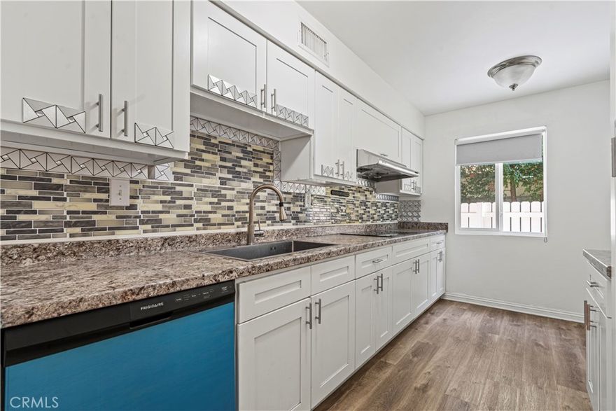 Beautiful Townhouse in the Heart of the Valley! Welcome to a well-maintained, gated community—ideal for first-time buyers, growing families, or anyone seeking a home in a prime Valley location!

Step inside to discover a bright and airy living space featuring stylish vinyl laminate flooring and brand-new windows that flood the home with natural light. The open-concept layout seamlessly connects the living room to the dining area, a cooktop and, new dishwasher.  A convenient bathroom is located downstairs for guests. Upstairs, you'll find three spacious bedrooms, including a comfortable primary suite. Additional highlights include in-unit laundry in the garage, central A/C and heat, and direct access to your own private two-car garage. 

Enjoy the beautifully landscaped, which offer a sparkling pool, and along with controlled access.

Centrally located near CSUN, shopping centers, restaurants, parks, schools, a hospital, and public transit, this home truly offers the best of Valley living.