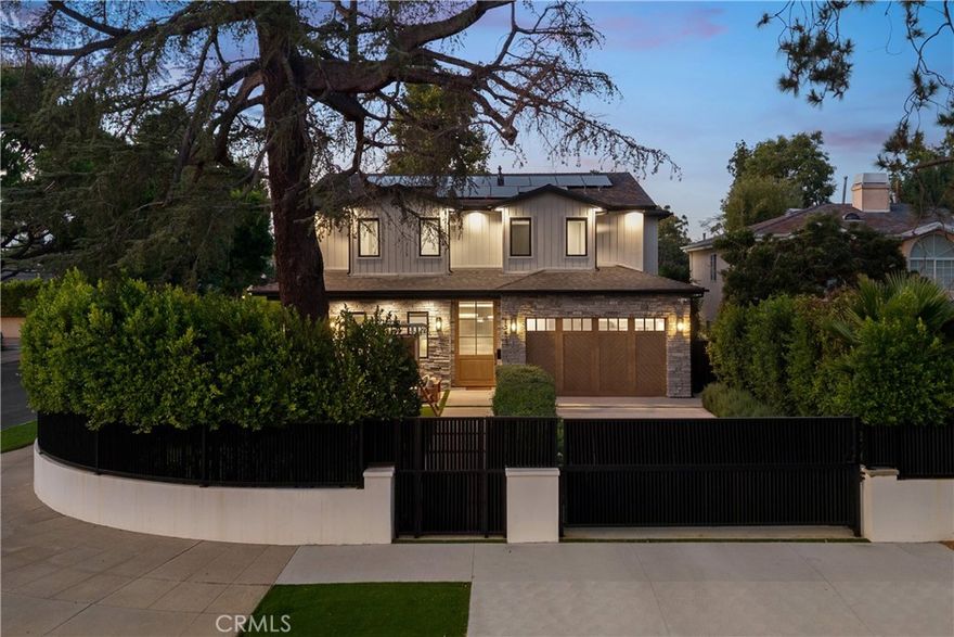 Nestled in the coveted Chandler Estates neighborhood of Sherman Oaks, this newer construction home sits on a gated corner lot, strategically setback from the street to create a private oasis. Designed for modern living, the spacious open-concept main level is anchored by a show-stopping chef’s kitchen equipped with top-of-the-line JennAir appliances and a massive island with seating. Floor-to-ceiling sliding glass doors in both the living room and formal dining room open seamlessly to the backyard, effortlessly extending your living space outside. Step outside to a serene retreat surrounded by mature privacy hedges and highlighted by a heated pool/spa, plus a built-in BBQ with bar seating – the ideal space to entertain or unwind after a long day. The gated front yard also impresses with a built-in fire pit and putting green. Upstairs, four generously sized ensuite bedrooms ensure everyone has their own private retreat, while a dedicated laundry room offers convenience. The sophisticated primary suite features a private balcony, custom walk-in closet and spa-inspired bathroom, complete with a soaking tub, oversized rainfall shower and double vanity. Additional highlights include a main-level ensuite bedroom, high ceilings throughout,  water softener system, reverse osmosis with instant hot water and added alkaline, a two-car garage with an EV charger outlet and smart home system with built-in speakers, security cameras, a Nest thermostat and more. Ideally located just moments from Westfield Fashion Square, Ventura Boulevard’s premier shopping and dining, and top private schools including Notre Dame, Harvard-Westlake, and Campbell Hall.