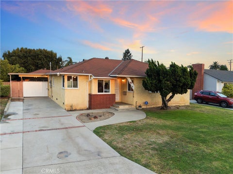 Photo of 9912 Tecum RD, Downey, CA 90240 (MLS # DW26143504)