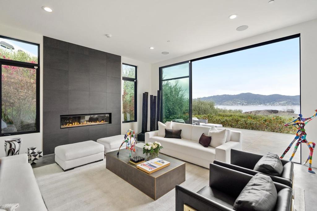 Newer construction (Built in 2016 & upgraded by Sellers), this rare contemporary masterpiece on prestigious Gilmartin Dr. has sweeping views of the SF Bay & Golden Gate Bridge. Excellent open floorplan for large scale events w/multiple indoor-outdoor entertaining areas incl. over 3000sq.ft. of outdoor terraces, a level lawn & modern landscaping. 4 en-suite bedrooms, office + full bathroom, den, library, family room, grand dining room & formal living room. Flooded w/natural light, high ceilings, extensive glass, sliding patio doors, dramatic gas fireplaces, & master suite w/spa-like bath retreat. Stunning gourmet kitchen w/massive island, designer Miele appliances, & Arclinea custom Italian cabinetry. Seller luxury additions & upgrades incl. large office w/full bath, patio, massive 1700+ sq.ft. crawlspace/underground storage, Sonos ceiling sound system, extensive cabinetry, custom window coverings, & more. Ideal walking & biking proximity to seaside paths, parks & nature hiking trails!