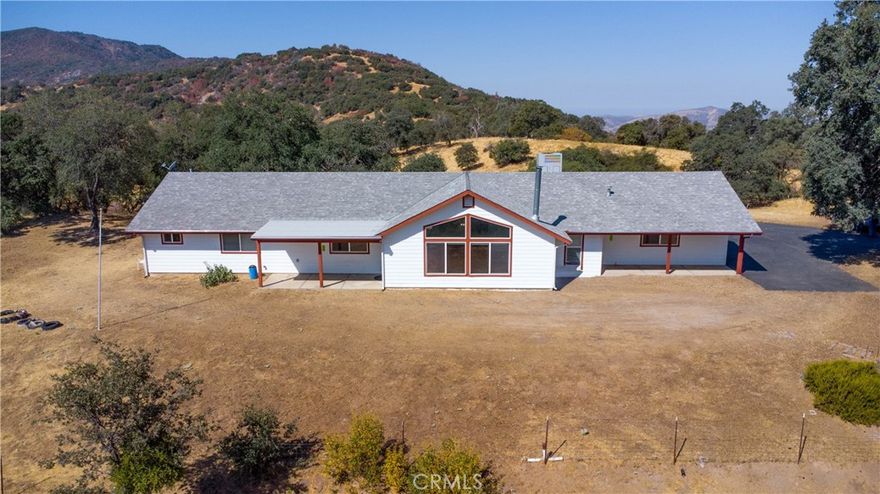 Price reduced from $670,000 to $614,000. Discover this 59.43 acre property that has a 2,416 square foot home that was built in 2003. First time on the market since the owners built the home. This well maintained home has 4 bedrooms, 2.5 bathrooms and sits atop a secluded knoll. From the extra large living room bay window there are magnificent views of the Sierra Mountains and the valley below. The view is amazing when the mountains are covered with snow. There is also an attached 2 car garage and a lot of extra parking. This property recently had horses, cows and goats roaming the vast 59.43 acres. Recent upgrades include a new A/C and bought and paid for Solar with a back up unit. Also, there is a septic tank, heat pump and a 5,000 gallon water tank. This property is close to the Sequoia National Park, Kings Canyon National Park and Lake Hume.