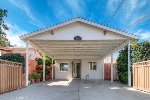 Photo of 13317 Bixler Ave, Downey, CA 90242 (MLS # PW26049624)