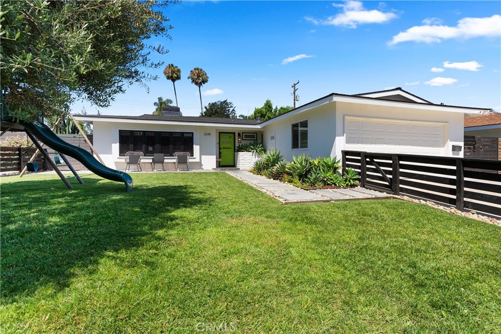 Welcome to 3249 Michigan Avenue, a stunning single-story residence located in the
highly desirable State Streets neighborhood of Costa Mesa. This fully remodeled
home offers a perfect blend of style, comfort, and functionality, with thoughtful
upgrades throughout that make it truly move-in ready.
Inside, you’ll find an open-concept layout centered around a dramatic dual-sided
fireplace, creating a warm and inviting atmosphere that connects the kitchen, dining,
and living areas. The kitchen has been completely transformed with custom real walnut
hardwood cabinets, granite countertops, "Cafe series matte white" appliances, and a large
center island designed for both casual dining and entertaining. Porcelain tile floors throughout enhances the home's natural flow.
Each of the three bedrooms includes custom window coverings, new carpet, ceiling
fans, and dual-pane vinyl windows that bring in plenty of natural light. The
bathrooms have been tastefully updated with modern vanities, fixtures, and tiled
showers, offering both comfort and sophistication.
The home’s exterior has been freshly painted, and the backyard is an entertainer’s
dream, featuring a spacious covered patio and a built-in outdoor BBQ area that’s perfect for
hosting family and friends. A new roof was installed within the last three years, and
the fully paid-off solar panel system (includes battery) provides significant energy efficiency and
long-term savings.
Additional highlights include central heating and air conditioning, a two-car
attached garage, and mature landscaping that frames the home beautifully. Located
near local parks, shops, and highly rated Newport-Mesa schools, this home offers the
best of Southern California living in a quiet, established community.
3249 Michigan Avenue is a rare opportunity to own a thoughtfully upgraded home
in one of Costa Mesa’s most sought-after neighborhoods