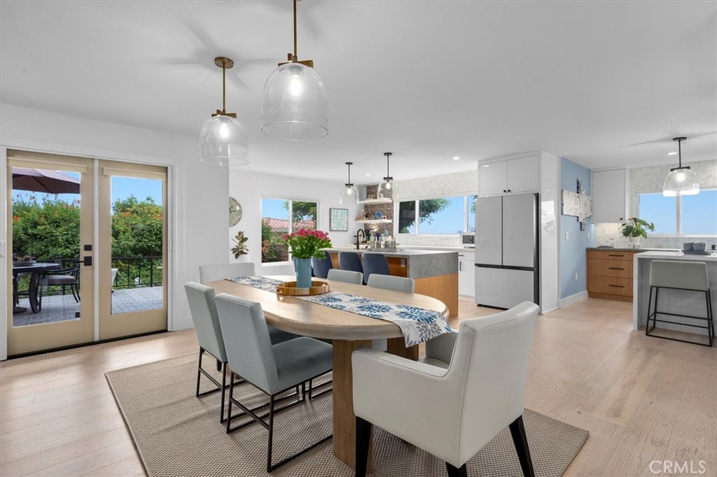 A turnkey luxury townhome nestled in the desirable Rolling Hills Park Villas Community. This beautifully renovated 3-bedroom, 2.5-bath home showcases a comprehensive transformation completed in March 2024. The renovation artfully combines elevated design and thoughtful function, all just minutes from the coastline and surrounded by tranquil natural beauty.
The fully reimagined open-concept main level offers seamless flow between the living, dining, and kitchen areas. At the heart of the home is a show-stopping chef’s kitchen, featuring dual center islands with partial waterfall-edge finishes, Caesarstone Porcelain and Cambria Quartz countertops, custom two-tone cabinetry, and top-tier appliances. These include a 48” Kucht double-oven gas range with a custom hood, a built-in 30” microwave drawer, a dual-temperature beverage cooler, and a dedicated coffee bar with open shelving.
Upstairs, the primary suite and additional bathrooms have been redesigned with high-end finishes, including custom vanities, elegant fixtures, designer tile, and luxurious walk-in showers. One of the secondary baths also features a deep soaking tub, creating a spa-like retreat at home.
Throughout the property, no detail was overlooked. Notable upgrades include all-new cooper plumbing and electrical systems with modern lighting (recessed, pendant, under-cabinet, and exterior), a new garage sub-panel, and wide-plank Aspen Silver Cloud Hickory wood floors. Windows, doors, and hardware have all been replaced, including French doors with retractable screens and a newly added kitchen window to enhance ocean views, complemented by cellular shades. Comfort is ensured with a new HVAC system featuring dual-zone controls, a new AC compressor, furnace, and ductwork.
Additional improvements include custom closets throughout, extensive garage cabinetry and storage, a freshly tiled fireplace, a redesigned stairway with updated banister, and new interior and exterior paint. The exterior also boasts new siding, updated stucco around all windows and doors, new gutters and downspouts, and improved drainage systems. A newly tiled patio and courtyard offer the perfect setting for outdoor entertaining.
With its ocean views, peaceful location, and a fully permitted 2024 renovation, this move-in-ready townhome presents the best of South Bay living—complete with community amenities, access to local nature trails, and enrollment in top-rated Palos Verdes Peninsula schools.