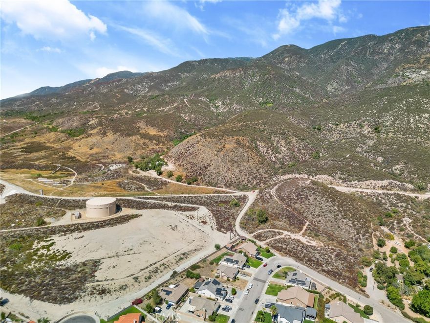 A rare opportunity to own almost 22 acres in North San Bernardino! It has incredible views and is offered together as three separate parcels. The first parcel (APN 0265-061-08), with 1.3 acres has road access and utilities available. It is well suited for a custom estate or the start of a small development project. The second parcel (0265-061-20), approximately 2.86 acres, features elevated views and provides an excellent setting for a hillside residence, retreat, or continuation of a development project from the first parcel. The third parcel (0265-061-18), roughly 17.7 acres with power available, offers seclusion as well as excellent potential for broader development or equestrian use. Located just minutes from Cal State San Bernardino, this property is also close to shopping, dining, public transit, and major highways—offering the perfect blend of privacy and convenience. All together, these properties create a unique value opportunity for buyers interested in building, investment, or establishing a private estate with room to grow. Seller may entertain selling the 2 smaller parcels separate. Buyer and Buyer’s Agent to verify zoning, use, boundaries, and utilities to their satisfaction.