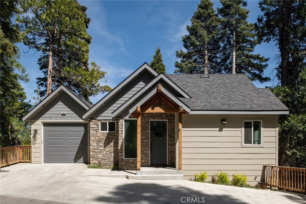 Meet Primrose Lodge! A luxury mountain getaway built in 2022 and designed with hosting in mind. Just two minutes from Lake Arrowhead Village and a short walk to the lake, this 6 bedroom, 5 bath home blends elevated comfort with laid back mountain living.
One of the best parts? A level driveway, one car garage, and easy level entry straight into the main living space (no stairs needed). Inside, you’re welcomed by a spacious open layout with high end finishes throughout: quartz countertops, European style cabinetry, stainless steel appliances, a large kitchen island, and curated mountain inspired decor. The main level features a fully stocked gourmet kitchen, cozy living room with views of the pines, fireplace, dining area, expansive deck, and a primary suite.
Downstairs offers just the right amount of extra space with a bonus living room, two guest bedrooms connected by a full bath, and another spacious deck with a fire pit, perfect for chilly mountain evenings.
The bottom level includes an additional primary suite plus two more bedrooms with a shared full bath. All six bedrooms are thoughtfully furnished with comfort and ample closet space in mind. The bathrooms feature ceramic flooring, quartz countertops, high end fixtures, hardwood cabinetry, and luxury quality towels and toiletries.
Primrose was made for entertaining, indoors and out. With two large decks, lounge seating, outdoor dining, fire pits, and a BBQ, it’s the ultimate mountain getaway.
Other key highlights include two A/C units covering all three levels, dual laundry rooms, an EV charger, and parking for up to four vehicles.
With lake rights, a strong rental history, an easy walk to the Village and lake, and being sold fully furnished, Primrose is ready for its next chapter. Whether that's a weekend getaway, full time escape, or income producing investment.