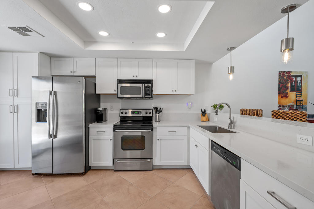 Newly renovated kitchen! This Turnkey FURNISHED Jacaranda model has SOUTH fairway VIEWS. Front courtyard patio for privacy and an extended rear patio complete with interlocking pavers and views of the 16th Fairway, Championship Course. This light airy condo has been freshly painted and has newer A/C and ducting. Move in ready for you or ready to rent. Palm Valley Country Club is a guard gated community with the look and feel of a vacation resort. The community's private golf club includes 2 Ted Robinson designed golf courses and 100,000 sq ft clubhouse with bar, lounge and restaurant, fitness center, spa, resort style pool area, proshops, practice facilities and 16 tennis courts. There are also 46 pools and spas. EXCELLENT primary, part-time or VACATION RENTAL property. Short term rentals are allowed in Palm Valley Country Club; ''The Fun Club for ALL ages.''