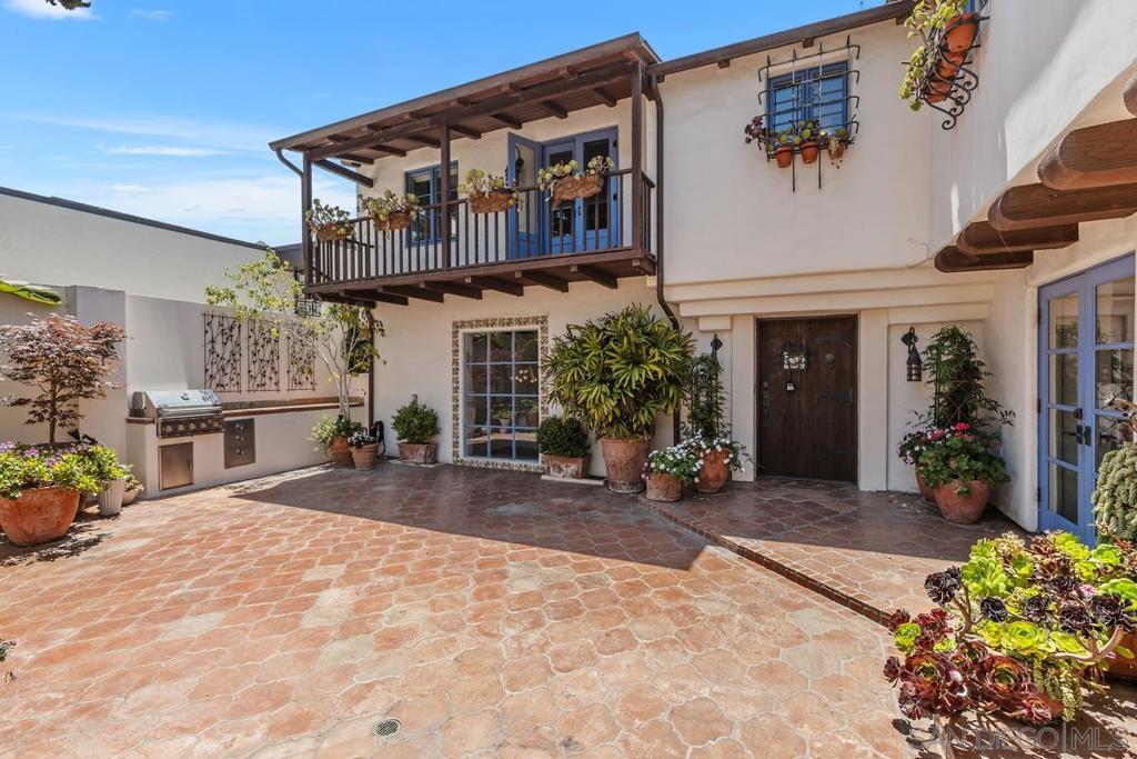 Welcome to 7728 Ludington Place – a one-of-a-kind, 5Bd/5.5Ba gated multi-structure La Jolla retreat with appx 4,146SqFt of total living space located in La Jolla Heights! Truly a rare find. This La Jolla estate offers privacy, scale, and character rarely found in today’s rental market. Set on a nearly 10,000 square foot lot, this serene Spanish Colonial Revival inspired compound features three separate living structures thoughtfully designed with two central courtyards, Saltillo-tiled walkways, outdoor fountains & lily pond w/ coy fish, multiple balconies, sprawling tiered backyard patio and outdoor seating areas surrounded by lush, mature greenery. This residence epitomizes La?Jolla’s 1920s charm and provides a perfect atmosphere for both relaxation and entertaining. A true sanctuary just minutes from La Jolla Shores, the Village, and UCSD. 7728 Ludington Place features a main residence, detached casita and a studio unit with patio located atop the large 2 car garage. The multi-structure layout is ideal for multi-generational living, remote professionals looking for dedicated office or studio space, or anyone seeking versatility, privacy, and space in one of San Diego’s most iconic neighborhoods. Welcome to 7728 Ludington Place – a one-of-a-kind, 5Bd/5.5Ba gated multi-structure La Jolla retreat with appx 4,146SqFt of total living space located in La Jolla Heights! Truly a rare find. This La Jolla estate offers privacy, scale, and character rarely found in today’s rental market. Set on a nearly 10,000 square foot lot, this serene Spanish Colonial Revival inspired compound features three separate living structures thoughtfully designed with two central courtyards, Saltillo-tiled walkways, outdoor fountains & lily pond w/ coy fish, multiple balconies, sprawling tiered backyard patio and outdoor seating areas surrounded by lush, mature greenery. This residence epitomizes La Jolla’s 1920s charm and provides a perfect atmosphere for both relaxation and entertaining. A true sanctuary just minutes from La Jolla Shores, the Village, and UCSD. 7728 Ludington Place features a main residence, detached casita and a studio unit with patio located atop the large 2 car garage. The multi-structure layout is ideal for multi-generational living, remote professionals looking for dedicated office or studio space, or anyone seeking versatility, privacy, and space in one of San Diego’s most iconic neighborhoods. MAIN RESIDENCE - 4Bd/3.5Ba (w/ additional optional bedroom), 3,562 SqFt The 3,562 SqFt main residence boasts 4 bedrooms and 3.5 baths with an additional optional bedroom, including a spacious downstairs primary suite, three upstairs bedrooms and a downstairs room with walkout DETACHED CASITA - Studio/1Ba Privately situated in the center of the property, this standalone casita offers incredible flexibility—ideal as a guest suite, art studio, home office, gym, or extended stay space. Though technically a studio, the layout includes a tucked-away alcove perfect for a bed, creating a sense of privacy while still maintaining the open-concept feel. The space features exposed beams, terracotta tile floors, and two sets of double French doors that open onto the beautifully landscaped courtyards and walkways —seamlessly blending indoor and outdoor living. The attached bathroom is wet-room style and ADA accessible, featuring a zero-threshold entry, handrails, built-in shower seating, and a ceiling-mounted curtain track to define the space. With thoughtful design and ground-level access, this flexible-use structure functions beautifully for a wide range of living, creative, or work-from-home needs. UNIT ABOVE GARAGE – Studio/1Ba Sitting above the garage and accessed via a private exterior staircase equipped with a rare ADA-friendly stair chair lift, this standalone studio offers a flexible living space with vaulted ceilings, exposed beams, and peaceful treetop views. The charming kitchenette is well-equipped with generous countertop spa...