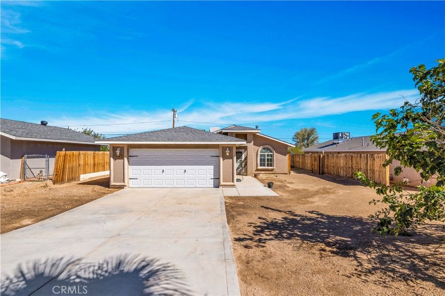 Call today, this one won't last! This home is in the heart of 29 Palms with just a short drive to anything you need, from grocery shopping, restaurants, the USMC Military Base, and the all-famous Joshua Tree National Park. The bright, open living room has a wood-burning stove to keep you cozy in the winter. The kitchen comes equipped with a Refrigerator, a Stove, and a Dishwasher, along with ample cabinet space. The private backyard is perfect for entertaining, featuring a covered concrete patio with an extended cover and a picnic table to accommodate all your guests. All bedrooms are decent size with great closets and new ceiling fans. The two-car attached garage is sure to not disappoint with a built-in workbench.



***IMPORTANT NOTE TO ALL AGENTS AND BUYERS. This house and property have experienced severe flash flooding and water intrusion within the last two years. Once in July of 2024. At that time, the property was restored to its pre-flood condition, where it continued to serve as a long-term rental. Then again, in August of 2025. The following restoration services have been performed and completed: Wet and damaged drywall, insulation, and baseboard have been removed. A dryout and moisture test have been completed along with extensive tractor work and grading. The current condition of the property is as seen in the listing photos.