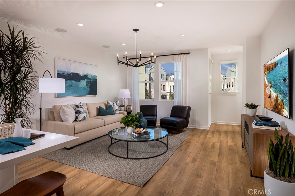 Discover the Brand New Beacon Plan 2 at Eastvale Square—a spacious and versatile three-story condominium with up to 1,977 sq. ft., featuring 4 bedrooms, an optional den, and 3.5 baths. Designed with an open and flexible layout, this home offers modern style and convenience for today’s lifestyle. On the entry level, you’ll find a 2-car side-by-side garage with direct access to a first-floor bedroom/den and a full bathroom, perfect for guests or a home office. The second floor boasts an open great room, a dining area, and an upgraded kitchen complete with a large island, powder room, and a covered outdoor deck—ideal for relaxing or entertaining. The third floor provides enhanced privacy, with a spacious primary suite featuring a walk-in closet, an additional bedroom and bathroom, and a laundry area with an included washer and dryer. Designer-selected upgrades add elegance, including luxury vinyl plank flooring, quartz countertops with a full tile backsplash, sleek white cabinetry, and 9-foot ceilings on each level. Smart home features, a washer, dryer, refrigerator, and leased solar are also included for energy efficiency and convenience. The Eastvale Square community offers a resort-style lifestyle, with exclusive resident amenities such as pools, spas, BBQ areas, parks, and scenic paseos that connect to local shopping, dining, and entertainment options. Enjoy outdoor activities in a vibrant neighborhood designed to enhance your lifestyle.