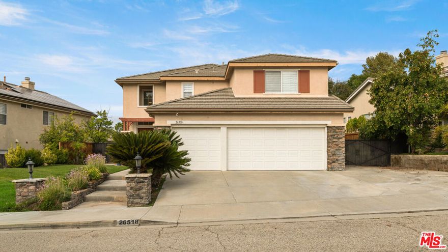 Exquisitely remodeled and thoughtfully designed, this contemporary two-story home offers nearly 3,200 square feet of stylish living space, featuring stunning finishes throughout. At the heart of the home is a beautifully updated kitchen with a striking stone center island, breakfast bar, and abundant cabinet and counter space perfect for both everyday living and entertaining. The open floor plan includes a formal living room and dining area, as well as a spacious family room with a fireplace that flows seamlessly into the kitchen. A large upstairs loft offers flexible use as a media room or office area. The primary suite is a true retreat, complete with a private balcony showcasing panoramic views of the mountains and valley. It also features two oversized walk-in closets, dual vanities, a spa-style soaking tub, and a separate shower. Step outside to a backyard built for entertaining, with a sparkling pool, Jacuzzi, and a generous side yard. Additional features include a 3-car garage and dedicated laundry room. Residents enjoy access to community amenities including tennis and racquetball courts, a sport court, kids' playground, BBQ area, and scenic hiking trails. This amazing estate is ideally located near top-rated schools, shopping, 30 minutes from downtown Los Angeles and has no Mello-Roos tax.