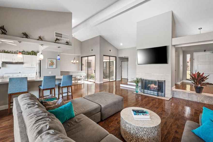 This hidden gem at The Lakes CC is tastefully remodeled in a neutral palate with a light, bright and spacious feel, complemented by beautiful golf course views. The home offers 2 bedrooms, 3.5 bathrooms plus a den, and features an open floor plan with engineered wood flooring, new dual pane windows and sliders, and an intact atrium that gives an ambience of added light. Additional features include an upgraded primary bathroom with tiled shower, and beautiful tiled flooring in both the primary and guest bathrooms. The kitchen boasts quartz counters and a breakfast bar with colorful pendant lighting. Situated on the first hole of the East Course, the extended patio just screams entertainment with its misting system, large dining area and generous seating area for you and your guests to enjoy. The perfect place to sip your coffee or cocktail and watch the golfers go by! A dream garage with epoxy floor and extra storage completes the package. Conveniently located in the community with the clubhouse, wellness center, main pool and driving range just a short walk from the home. Being offered furnished (per inventory) and ready for you to move in and start your new life at The Lakes with its incredible 27 holes of golf, new wellness center (including a spin room, Pilates, lap pool and a spa), tennis, POP tennis and pickle-ball.