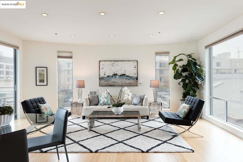 Sunlight is plentiful from every room of this 2-bedroom, 2 and a half-bath urban oasis. There is a Zen like quietness in this David Baker retreat. From the floor to ceiling windows, natural light illuminates all the designer finishes, from the bamboo flooring, the Studio Becker cabinets, Terrazzo tile, and Grohe fixtures. Generous granite countertops, abundant cabinetry, stainless steel appliances, and gas cooking are the perfect mixture of elegance and function in the open kitchen. The kitchen and living design allow perfect interaction and plenty of space to gather. Step out on the balcony to take in the fresh air. The bedroom designs are perfect, allowing privacy for guests and plenty of room for an office or even home gym. With a 98-walk score and convenient 5-minute walk to the Ferry Terminal or 12th St. BART, and a 20-drive to SF, getting around the bay doesn't get much better than this. Prepare to get swept away by the top-of-the-line experience, allowing for an unprecedented connection between relaxed living and a spectacular urban contemporary lifestyle that only Oakland can offer.