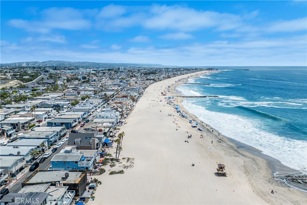 An incredible beachfront offering with approved plans for a down-to-studs remodel, this property rests on a corner lot in one of the most desirable locations in Newport Beach. Panoramic views stretch for miles: sandy beaches, Newport Pier, jetties, the endless Pacific Ocean and Catalina Island vistas. Watch waves crash from the comfort of your newly constructed home or enjoy beachfront living. Current plans by Rizzo Associates outline an approximately 1,412 square foot main residence and a ~564 square foot ADU, offering nearly two thousand square feet of flexible living space across three levels. Both spaces offer thoughtful layouts intended to maximize the on-the-sand location of this lot, with multiple outdoor spaces and a rooftop deck. Newport Beach lends itself well to part- and full-time living, with fantastic restaurants, world class shopping, famous surf spots, endless beaches, and easy airport access.