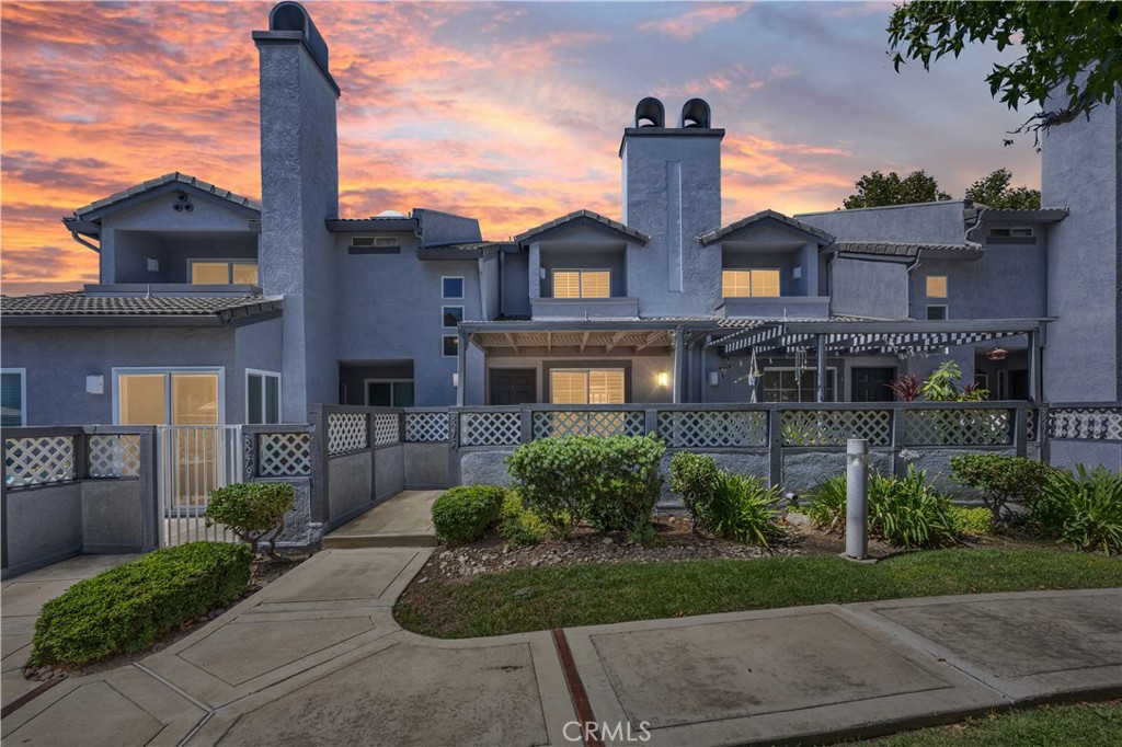 Welcome to Vintage Townhomes, ideally located off historic Route 66 in Rancho Cucamonga. This charming 2 bedroom, 3 bath townhome offers 989 sq. ft. of living space with thoughtful upgrades throughout. Enjoy a cozy living room with a custom fireplace mantle, stunning Bellawood Brazilian Koa hardwood floors. A private front covered patio, attached one-car garage and additional parking space add everyday convenience. HOA Community amenities include a sparkling pool & spa, walkways, a clubhouse, and well-kept grounds. Just 1-4 miles from shopping, dining, grocery stores, and the Route 66 trailhead, this home offers both comfort and lifestyle. Within 6 miles to freeway access, 10, 15, and 210.