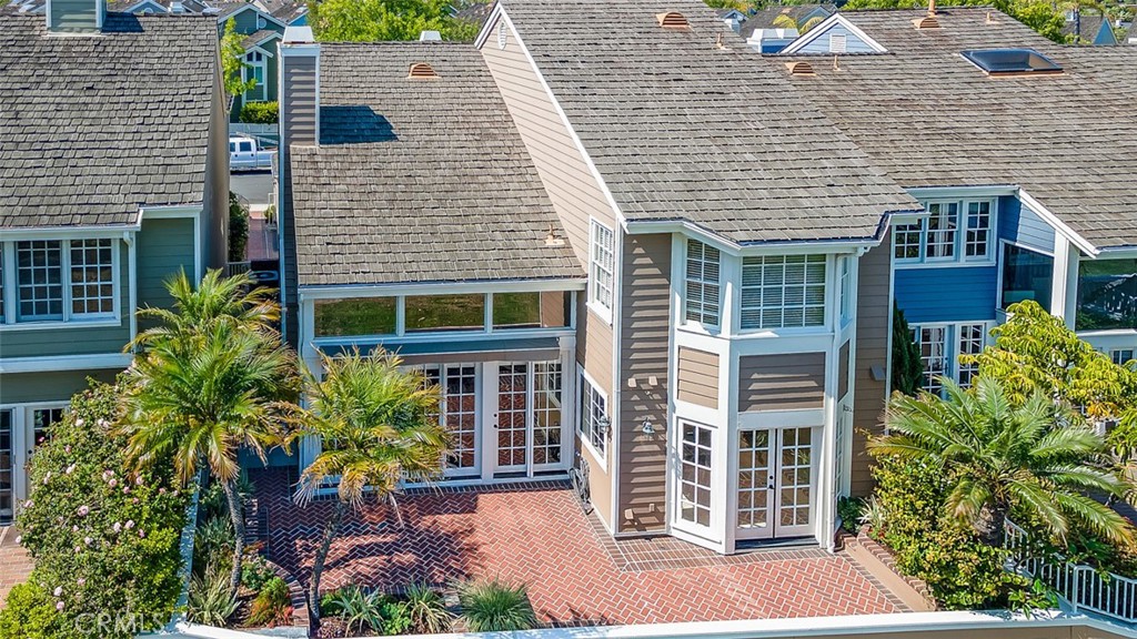 This is the Bixby Village Home you've been waiting for, located directly on the Golf course! This home is a rare and hard to come by model with a spacious downstairs Primary Suite, which includes a fireplace, en-suite restroom and walk-in Closet. The homes entry begins at your charming and private front courtyard, leading to the home's double door entry. Amazing views overlooking the golf course from the living room and kitchen. Both the kitchen and living room open directly to the back patio making this home ideal for entertaining. The large kitchen features granite counter tops, a chef's range and plenty of storage. There is also direct access from the kitchen to the formal dining room. Upstairs there are 2 additional bedrooms, plus an office with built-ins. If needed, the office could be converted to a 4th bedroom. 1 of the bedrooms also has huge golf course views. The 2-car garage just recently received brand new epoxy floors. The owners have also fully built out the space above the garage to create a 350sqft bonus attic space that provides additional office or gym and storage space with 2 skylights, cable TV, ceiling fan, built-ins and separate electrical sub-panel. The Bixby Village community is expertly and professionally maintained and also features 2 pools and a clubhouse. Great deal, priced well below Redfin Estimate!