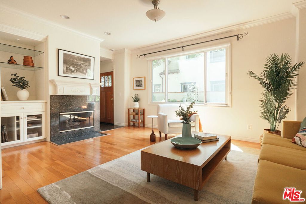 Tucked away in Pasadena's sought-after Madison Heights neighborhood, 322 Alpine St. #3 is a townhome like nothing else on the market: classic Craftsman charm, modern comfort, and private outdoor living, all in a boutique 6-unit complex moments away from some of the best shopping and dining in the city! Situated toward the back of the gated complex, enter from your private subterranean two-car attached garage and find yourself in a tasteful sanctuary built with modern convenience in mind. From the foyer, discover an open living/dining room with rich hardwood floors, elegant built-ins, marble-faced gas fireplace, and large windows that bathe the home in natural light. Enjoy meal prep in a kitchen with excellent cabinet space and stainless steel appliances, then enjoy dining al fresco outside on your own private patio - a rarity in Pasadena condo living. Upstairs, the primary suite is a calming retreat featuring ample walk-in closets with built-in organization and an ensuite bathroom with dual sink vanity and a deep jetted soaking tub. The second bedroom is sizable and features its own ensuite bathroom, good-sized closet, and treetop views. As practical as it is beautiful, the home was built in 2004 and features central A/C, in-unit laundry, additional storage in the garage, a shared community built-in BBQ, and close proximity to the Fillmore Gold Line station - not to mention being only a few blocks away from iconic Pasadena spots like Lucky Boy, Howlin' Ray's, and Superba. Whether you're savoring your morning coffee on the patio, taking in the tree-lined streets of Madison Heights, or enjoying the vibrant dining and shopping just minutes away in Old Town, South Pas, or on Lake, 322 Alpine St. is Pasadena living at its finest - don't miss this rare opportunity to own a slice of modern convenience and classic Arts and Crafts charm at an absolutely unbeatable price.
