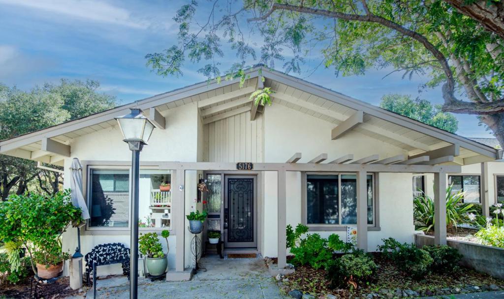 The Villages Golf and Country Club is a 55+ community with 24/7 guard-gated security. This large 1402 sq ft condo is a unique location that rarely becomes available. Don't miss your chance. This single-story end unit offers golf course views from a private fenced patio connected to both the living area and primary bedroom. The updated interior includes wood laminate floors throughout the whole condo, an upgraded kitchen with granite counters, gas stove, farmhouse sink, recessed lighting, and a breakfast nook. A skylight provides natural light between the dining and living rooms, which features a stone fireplace. French doors lead to the primary bedroom with ample closets and an updated bathroom featuring a jetted tub, tile, granite vanity, and sun tunnel. The secondary bedroom can serve as an office or guest room with a Murphy bed, and the second bath includes a tiled shower, granite vanity, and sun tunnel. Life at The Villages offers access to an 18-hole and a 9-hole golf course, driving range, fitness center, tennis, pickleball, bocce, pools spas, horse stables, and hiking trails. Residents can enjoy the organized activities and many clubs to join. Socialize at the bistro and enjoy fine dining in the dining room.