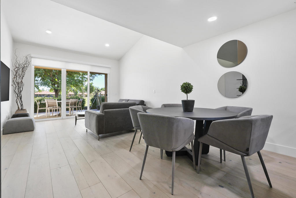 Step into style and comfort in this beautifully updated home, where every detail has been thoughtfully curated for modern living. The fully remodeled kitchen is a showstopper, featuring white quartz countertops, sleek modern-contemporary soft-close cabinets and drawers, and high-end finishes that make both everyday meals and entertaining a joy.Both bathrooms exude luxury with floating vanities topped with white quartz, modern soft-close cabinetry, and contemporary fixtures, including updated toilets. The primary bath offers a spa-like retreat with elegant ceramic tile on the shower and walls, complemented by tasteful tile flooring.Enjoy a cohesive, elevated aesthetic throughout the home with modern engineered wood flooring, custom roll-up window treatments, with a blackout shade in the primary bedroom for restful nights. Recessed and dimmable lighting allows you to set the perfect ambiance in every room, while new doors add to the fresh, modern feel.Outdoor spaces are equally refined, with slate tile in both the front courtyard and rear patio, offering durable beauty and low-maintenance style.This spacious condo boasts soaring vaulted ceilings, abundant natural light, and breathtaking views with mountains in the front and sweeping golf course vistas from the back patio.Experience the best of desert living at Sunrise Country Club, an iconic gated community in the heart of Rancho Mirage. Tucked away in the scenic Coachella Valley, this peaceful enclave blends luxury and natural beauty with lush landscaping and a picturesque 18-hole executive golf course.Residents enjoy access to 21 pools, 19 spas, 9 tennis courts, and active Pickleball and Bocce clubs, along with a newly renovated fitness center, clubhouse, and dining room. Whether you're indulging in a gourmet dinner or a laid-back Sunday brunch, the stylish Mixx Lounge offers the perfect setting.This move-in-ready home blends form and function, ideal for buyers seeking contemporary design, comfort, and convenience. Don't miss your chance to own this tastefully upgraded gem!