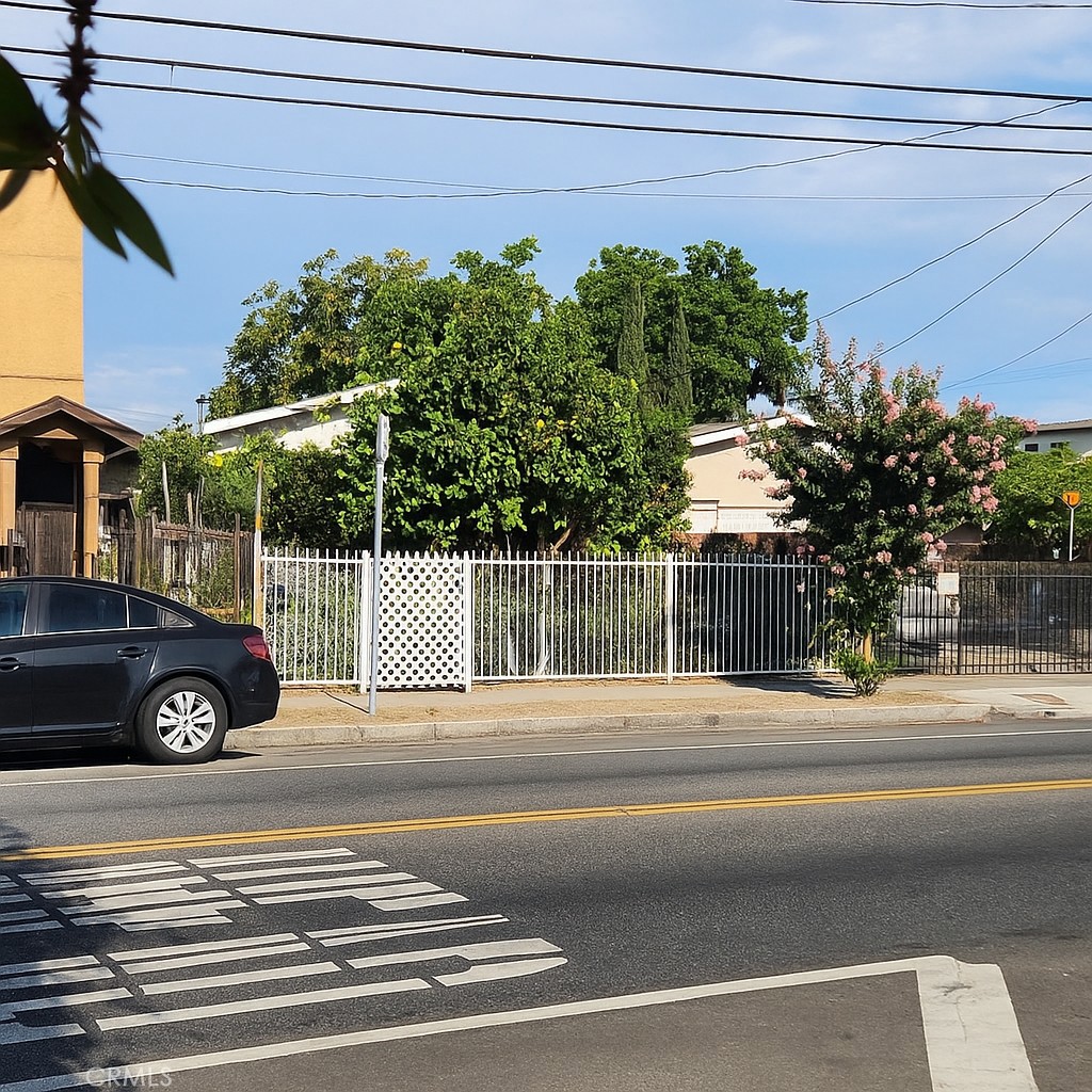 Strategically located in a designated Opportunity Zone in Los Angeles County, this 3-bedroom, 2-bathroom property offers potential tax advantages for investors or owner-occupants. The home includes an oversized 2-car attached garage, fully gated iron fencing, front and rear yards with mature fruit trees, and a welcoming porch. With a high walkability score and close access to public transit and local amenities, it combines functionality with convenience. The property is move-in ready with minor cosmetic updates and may qualify for multi-unit development—buyer to verify with the city. This is a results-driven opportunity in a rapidly growing area of Los Angeles with long-term upside potential.