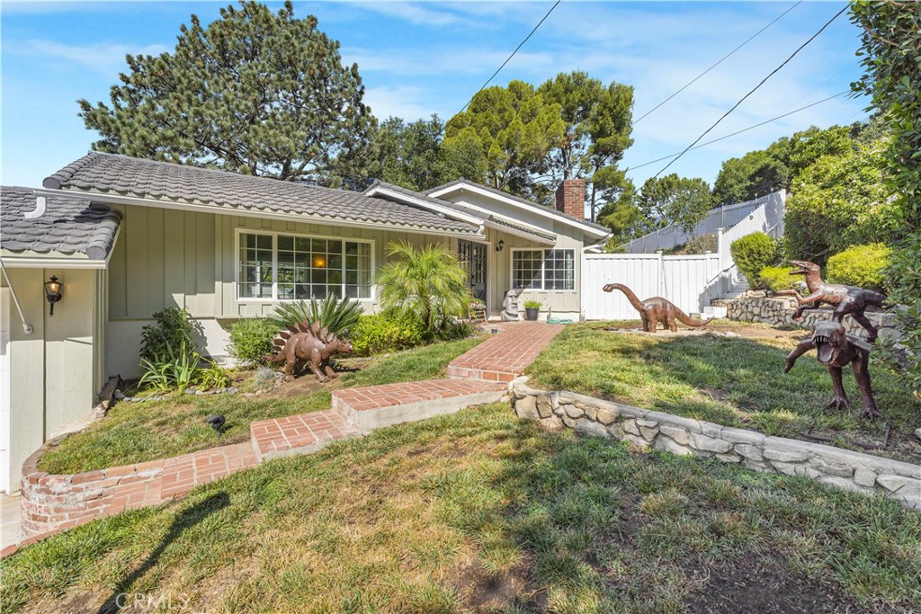 Welcome to this inviting 3-bedroom, 2-bathroom home in the highly sought-after Briggs Terrace neighborhood of La Crescenta. Situated on a flat 8,808 sq ft lot, this 1,485 sq ft residence offers a comfortable layout filled with natural light, featuring large windows and multiple doors that open seamlessly to the outdoor living areas. So close to restaurants, shopping, and freeways...yet the quiet privacy is hard to beat.
The main bedroom includes a private ensuite (3/4 bath), while a full bathroom for guests and family is in the hallway. The bright kitchen takes in stunning views of downtown Los Angeles and beyond, creating a perfect backdrop for daily living. Appliances are included, and the home provides abundant storage both inside and in the attached 2-car garage. The expansive, fully fenced backyard is ideal for entertaining, gardening, or future possibilities such as an addition or pool. Adding to its charm, the outdoor spaces are accented with whimsical dinosaur décor, bringing a playful and distinctive character to the property. Located within the boundary of the highly regarded Mountain Avenue Elementary School, this home combines comfort, convenience, and opportunity. Don’t miss your chance to own a home in this desirable La Crescenta community!
Additional photos coming soon.