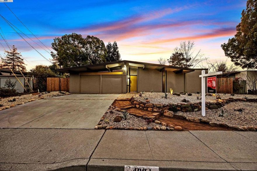 Stunning Remodeled Eichler in Concord’s Coveted Rancho de los Santos Neighborhood!  Experience mid century modern living in this beautifully restored home on Salem Street. Post and beam lines, an open air atrium, floor to ceiling glass, and seamless indoor outdoor flow highlight the classic architecture, enhanced by a full remodel with modern finishes.  The bright layout offers a modern chef’s kitchen, tasteful baths, and open living spaces filled with natural light. Four well sized bedrooms provide flexibility for family living, guests, or a home office.  The private backyard with a tranquil flowing water feature is ideal for relaxing or entertaining. Close to parks, shopping, dining, and commuter routes.  Rare opportunity Eichler in Concord. Don’t miss it!