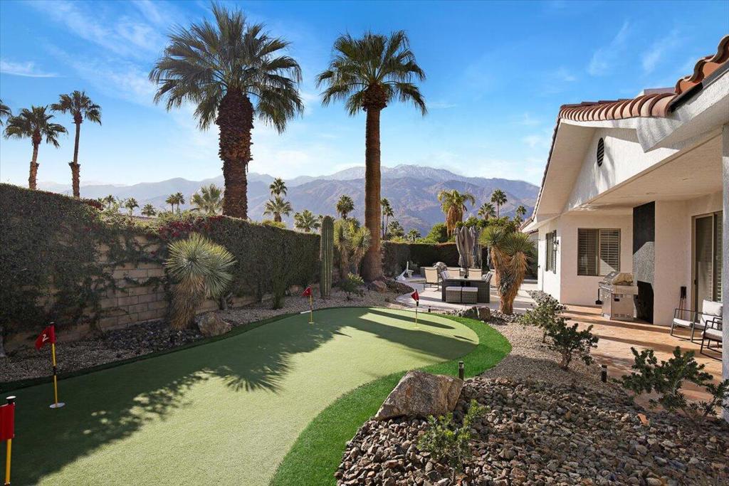 +++SELLER FINANCING AVAILABLE+++ Welcome to 2451 N Quincy Way, a meticulously maintained Contemporary Mediterranean residence in Palm Springs. This 4-bedroom, 3.5-bathroom home spans 2,817 square feet on a 0.26-acre lot, offering a harmonious blend of elegance and comfort.Built in 1994 by Irving B. Green, founder of Mercury Records, the home features high ceilings, a formal entryway, and an open-concept living area that seamlessly connects to the outdoors. The chef's kitchen is equipped with top-tier appliances and ample counter space, perfect for culinary enthusiasts.The primary suite serves as a serene retreat, complete with a spa-like bathroom and generous closet space. Three additional bedrooms provide flexibility for guests or a home office.Step outside to a private oasis featuring a sparkling pool and spa, all set against the backdrop of breathtaking mountain views. The landscaped grounds offer multiple areas for relaxation and entertainment.Modern amenities include a Tesla charger, solar panels, and a comprehensive smart home system controlling lighting, thermostat, and security. The property also boasts a two-car attached garage and is situated on fee land with no HOA fees.Located in a tranquil neighborhood, this home offers the perfect blend of sophistication and the laid-back Palm Springs lifestyle.