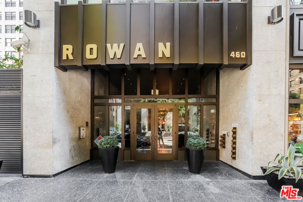 Stylish and beautiful loft in one of Downtown LA's most highly sought-after historic buildings, The Rowan. Located in the Old Bank District of the booming HistoricCore, the Rowan was exquisitely remodeled in 2008. This unit boasts wall-to-wall mahogany framed oversized windows, 10' ceilings, and exposed brick, which create a beautifully striking impression. Upon entry, you will find a spacious open kitchen and living area. A semi-private bedroom with built-in storage and a bathroom with a stackable laundry area is conveniently located behind the kitchen. Character-rich, historic design elements are perfectly counterbalanced with elegant, top-of-the-line, modern appointments, including Bosch stainless steel appliances, Toto bathroom fixtures, custom-made Scavolini cabinets, and granite countertops. Owner lived in this unit for five years and built it out as one of a kind. CUSTOM ISLAND included. CUSTOM CLOSETS throughout (including bedroom). CUSTOM RECESSED LIGHTING in ceilings. CUSTOM CABINETRY in kitchen. The building features a 24/7 doorman, barbecue area, hot tub, and lounge room. Close to a lot of dining spots, the metro, and Art Galleries. Next to the Spring St Park and Farmers Market. Parking is available for a fee.