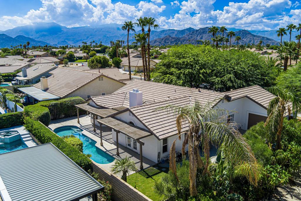 Welcome to 44150 Sweet Bush Lane, La Quinta, CALocated in the highly desirable Cactus Flower neighborhood of North La Quinta, this home offers the perfect blend of comfort and functionality -- all with no HOA fees.This spacious single-story home features a highly sought-after floor plan with 4 bedrooms and 2 bathrooms, including a flexible 4th bedroom currently used as a den with a custom built-in desk area -- ideal for a home office or study. Enjoy multiple living spaces with both a formal living room and a cozy family room, plus a charming breakfast nook just off the kitchen.The kitchen features granite countertops and ample cabinetry. Both bathrooms have been tastefully updated with contemporary design touches. The primary suite features a spacious walk-in closet, French doors that lead to the backyard with direct access to the sparkling pool.Step outside to the entertainer's yard, complete with a lap pool, multiple seating areas, and mature landscaping that provides beauty and privacy.Additional highlights include:3-car garagePlantation shuttersRecessed lightingGas fireplaceRecent upgrades for peace of mind:New roof (2020)Pool resurfaced (2023)New AC unit (2024)New water heater (2021)New refrigerator (2023)This home is ideally located near top-rated schools, shopping, dining, golf courses, and everything La Quinta has to offer.