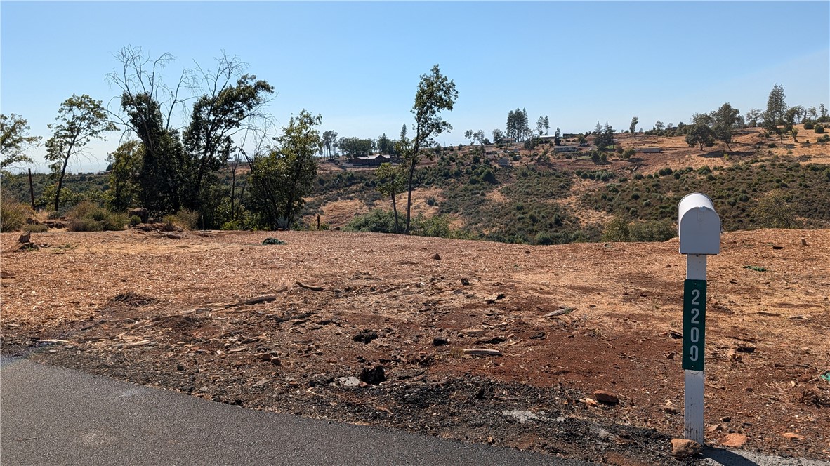 Here's the perfect lot for the buyer who enjoys a Canyon View! Centrally located in lower Paradise it is the perfect place to build your dream home. A seasonal Creek runs below the property line. The previous home was two bedrooms, two baths, a den and a two car attached garage. Water meter is installed and bill is paid to date. A new septic was put in just before the fire and has passed inspection. There are three pins on the property. Two at the street and one on the far corner.