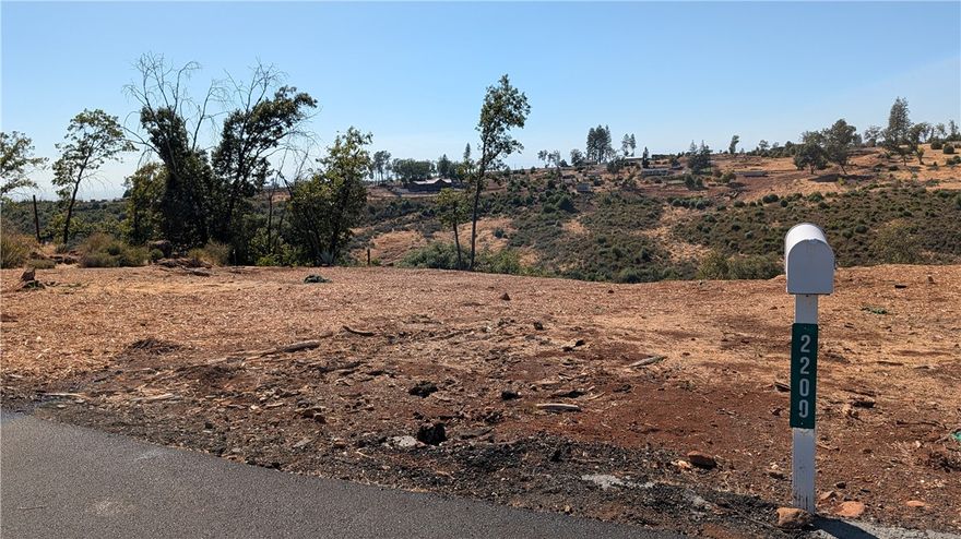 Here's the perfect lot for the buyer who enjoys a Canyon View! Centrally located in lower Paradise it is the perfect place to build your dream home.  A seasonal Creek runs below the property line.  The previous home was two bedrooms, two baths, a den and a two car attached garage. Water meter is installed and bill is paid to date.  A new septic was put in just before the fire and has passed inspection.  There are three pins on the property.  Two at the street and one on the far corner.