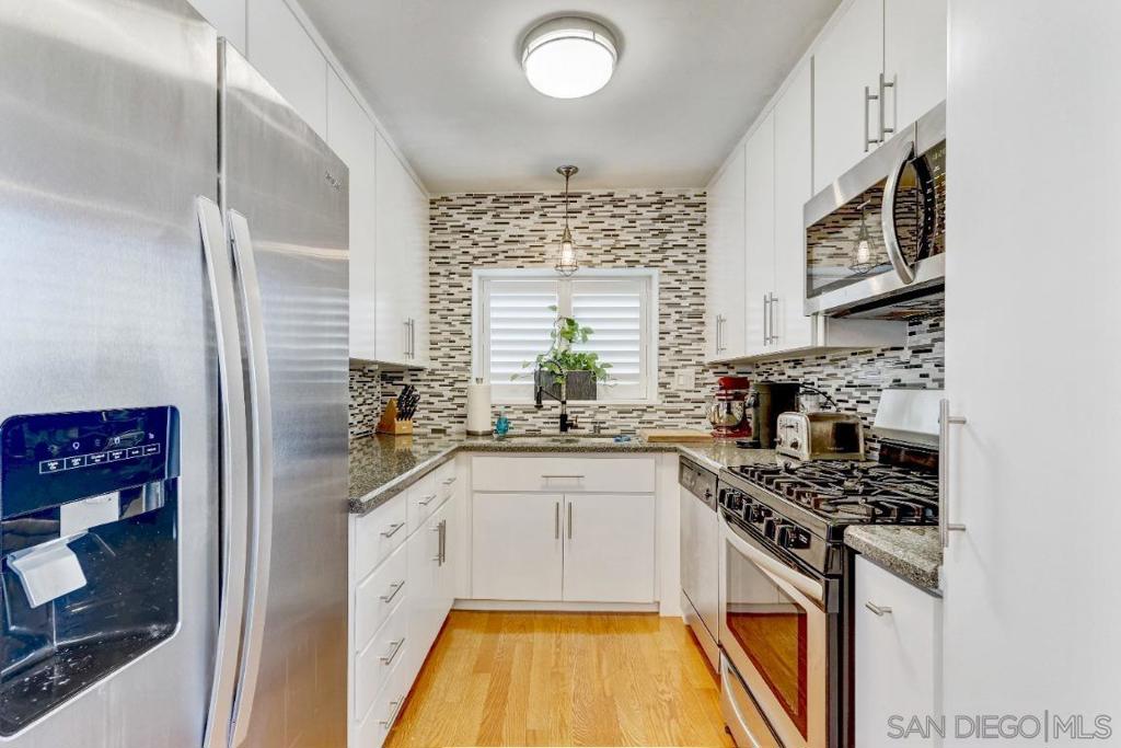 This spacious two-bedroom, two-bathroom condo is nestled in a cozy gated community in the heart of Crown Point. With 903 square feet of living space, the home is filled with natural light and features elegant wood floors, crown molding, and dual-pane windows. Inside, you'll find custom shutters and a modern kitchen equipped with stainless steel appliances. The property includes the added convenience of a one-car garage and benefits from a low HOA. Ideally located, it’s a short walk to restaurants and shops, less than half a mile from the bay, and just a mile from the beach.