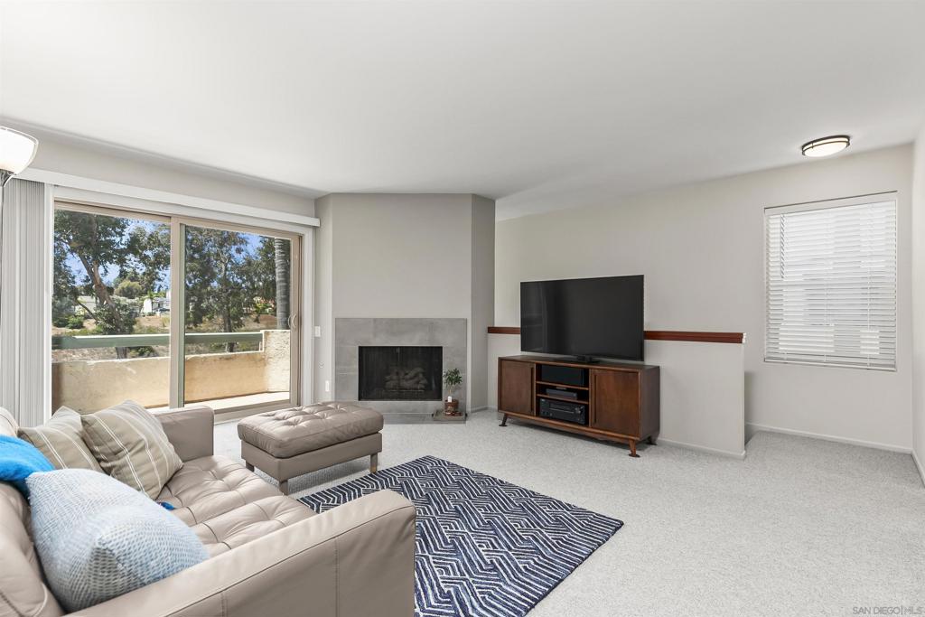 Immaculate Remodeled End Unit with Private Driveway, Canyon Views, Storage Galore & Direct Access to Hiking Trails. This beautifully remodeled 1-bedroom condo in the heart of Tierrasanta is a rare gem that lives much larger than expected! This end unit enjoys added privacy and is one of the few in the community featuring its own private-use driveway, along with an oversized 2-car garage featuring a hobby/workbench, direct interior access and abundant storage. Inside, you’ll find light, open-concept living space showcasing quartz countertops, new cabinetry, stainless steel appliances, dual-pane windows and a sleek glass shower enclosure - all thoughtfully selected with modern design and comfort in mind. This immaculate home is truly move-in ready. Enjoy breathtaking canyon and sunset views, relax by the community pool and step outside to find miles of scenic hiking trails practically at your front door - all with easy access to shopping, dining and major freeways. Opportunities like this don’t come along often — don’t miss your chance!