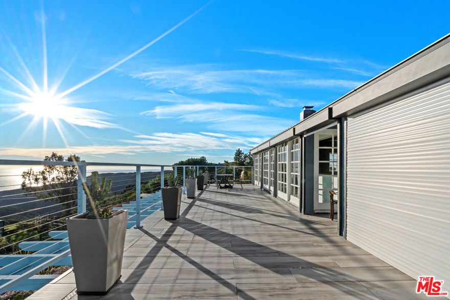 Enchanted peaceful paradise. This home is up one of the most beautiful canyons in Malibu, down a private road, perched on a hill with magnificent ocean views and canyon views in all directions. Meander through several paths in a magical garden of many different types of plants, cactus trees, flowers, succulents, and a most beautiful koi pond. The house is a comfortable country style home, with two stories. You enter from a large deck into a comfortable family room, private bed and bath, possible guest suite, washer/dryer closet.  Upstairs, comfortable living room/dining area, high vaulted ceilings, large stone fireplace, exit onto a large, impressive deck with wide ocean views. Master suite and bath, second bedroom and bath. Kitchen is modern, sitting nook, side patio, ramped access, outdoor shower. Covered carport, plus more, 2 driveways in and out. No need to leave, every day is a vacation.