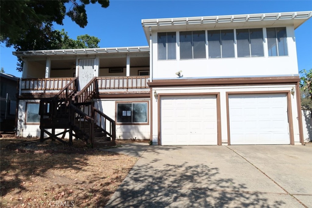 Truly one of a kind HUD Home, located next to Lake Oroville in the desirable Kelly Ridge Estates. Two bedrooms plus bonus rooms, with a overed deck that provides a perfect setting for relaxation and entertaining. Enter through the double doors to a spacious 20x20 sunroom. The open floor plan features a dining room, living room and family room with wet bar. a cozy woodstove for those cool evenings ahead. Easy to maintain the mature landscape, lawn and variety of (?) fruit trees. There is a 2 car garage with additional storage area and bonus rooms below that could be used for a third bedroom, hobbies or a workshop? A oversized covered carport with hookups is just waiting for an RV, boat or trailer in the back and all accessible from Arroyo Dr. which goes directly to Bidwell Marina. Call now for a showing of this exceptional home with endless recreational opportunities nearby.