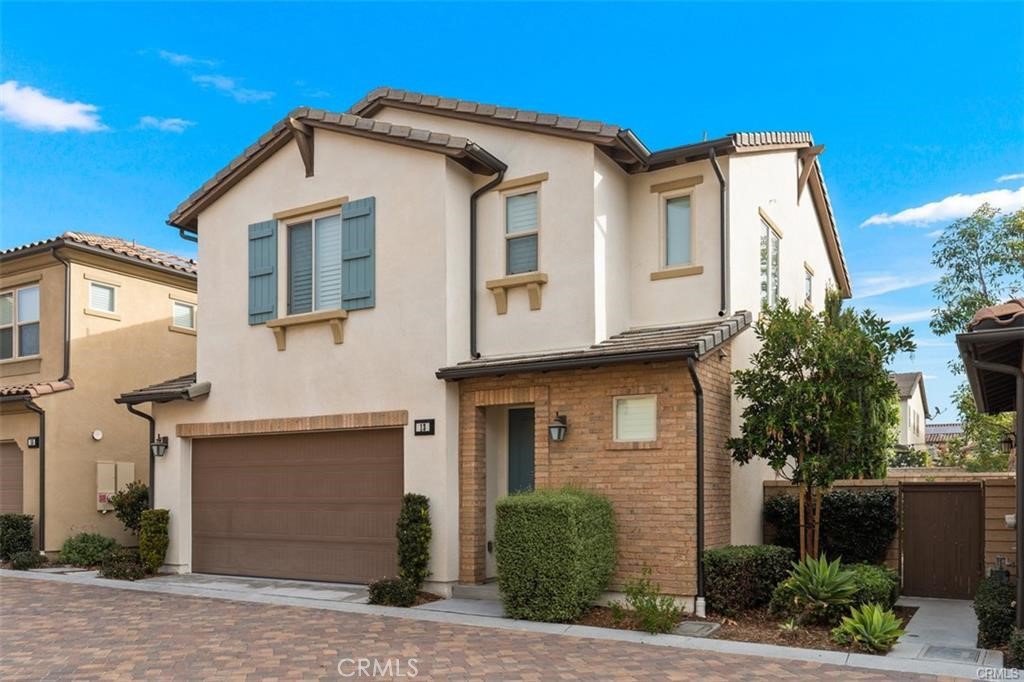 Situated on a premium lot with no one directly behind you, surrounded by resort-like amenities, in this stunningly upgraded Plan 1 Knolls home located in Baker Ranch. Featuring 3 bedrooms and 2.5 bathrooms with 1,621sf of living space and a private low-maintenance yard. Surrounding large dual pane windows with shutters throughout the home allow for abundant natural light. Upgraded kitchen which opens to the family room features granite countertops, SS appliances, subway tile backsplash, and a large kitchen island. The spacious master bedroom has a his/hers walk-in closets and the master bath is upgraded, featuring a walk-in tiled shower and rain shower head along with upgraded dual vanities boasting extensive counter space and storage. Generous secondary bedrooms provide flexible spaces, perfect for an office or a growing family, along with the Jack-n-Jill bathroom with dual vanities and soaking tub in shower. An upstairs laundry room ensures convenience, with countertops and a utility sink. The home also features upgrades such as wood flooring downstairs, upgraded carpet on the stairs, premium laminate flooring upstairs, plantation shutters throughout, and many more. Zoned to the Saddleback Valley Unified School District including Foothill Elementary. Enjoy all the amenities of Baker Ranch with 5 swimming pools and swim club, clubhouses, basketball courts, volleyball court, playgrounds, a dog park, barbeque stations, walking and hiking trails, and 11 parks. All appliances included and pets are allowed with additional deposit.