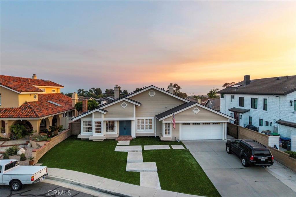 Discover the ultimate Southern California lifestyle in this stunning 3-bedroom, 2-bathroom home located in the heart of San Clemente. Designed for comfort and elevated living, this beautifully furnished property combines upscale amenities with the relaxed charm of coastal living. Inside, you'll find a spacious and stylish interior featuring central air conditioning and heating, a convenient in-home washer and dryer, and a cozy fireplace perfect for cool coastal evenings. Entertainment is at your fingertips with a 76-inch TV in the family room, a 65-inch TV in the master suite, and a 50-inch TV in the guest room. Even the chef’s kitchen is equipped with a 34-inch TV, double ovens, and a microwave—perfect for cooking and gathering with family and friends. Step outside and enter your own private resort-style oasis. Relax in the hot tub while watching the sunset, or practice your short game on the private putting greens—complete with glow-in-the-dark golf balls for nighttime fun. The expansive outdoor kitchen is an entertainer’s dream, featuring a high-end stainless steel BBQ grill with rotisserie, outdoor gas burners, a large refrigerator, beer and wine fridges, an ice maker, garbage disposal, and plenty of prep space. Host unforgettable dinners with seating for up to 24 at the oversized outdoor dining table, complemented by a large bar area, teak lounge furniture, and a stylish patio setup. Outdoor speakers and ambient perimeter lighting create the perfect atmosphere for evening gatherings under the stars. Whether you're unwinding in the hot tub, entertaining guests, or simply enjoying the coastal breeze, this home offers a seamless blend of indoor comfort and outdoor luxury. This is more than just a rental—it's a lifestyle.