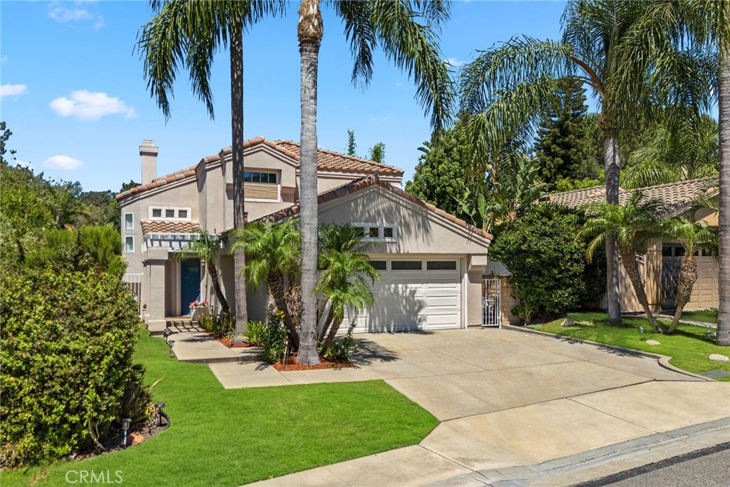 Imagine a stunning two-story home exuding a modern vibe with crisp clean lines, and designed with an abundance of natural light streaming through numerous large windows. The formal living and dining rooms welcome you inside, featuring a minimalist feel that seamlessly blends style with functionality. Soothing neutral wall tones and wood-look flooring dress the lower level of this home. The spacious family room captures your attention with its cozy fireplace, perfect for gatherings or quiet evenings. The adjacent kitchen boasts sleek countertops and shaker-style white cabinets with stainless steel appliances. A convenient breakfast nook and casual dining counter round out the desirability and functionality of this area. Conveniently located on the main level is a bedroom or office space if needed, plus a full bath, ideal for guests or multigenerational living. Ascending the staircase, you find three additional bedrooms. The primary suite stands out with its luxurious oversized shower and expansive walk-in closet, providing a serene retreat to enjoy each and every day. Stepping outside to your completely private setting, you are greeted by a sparkling pool and bubbling spa, beckoning you to splash away or relax and unwind after a long day. A sunny patio is perfect for al fresco dining, and the serene views of the surrounding trees and distant views create a serene and uncluttered atmosphere to savor. A fun sports/basketball court is tucked on the side of the home allowing for vigorous fun. This home is located in a commuter friendly setting, attends Running Springs Elementary and enjoys nearby shopping and favorite restaurants.