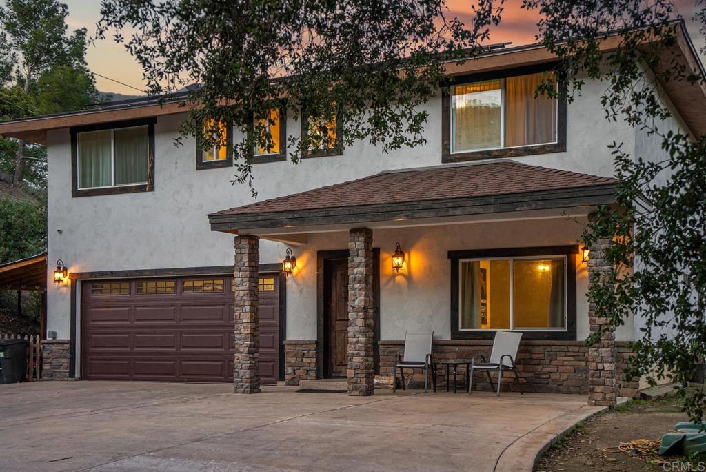 Assumable VA Loan at 2.5%! Experience serene living on 3+ picturesque acres with this 2020-built 5-bed, 3-bath home featuring a fairy tale-like setting, majestic oaks, a seasonal creek, and scenic boulders. The open floor plan offers a modern kitchen with quartz finishes, waterproof vinyl flooring, and a luxurious primary suite with spa-like features and walk-in closets. Enjoy full Tesla solar with battery backup, water softener system, security cameras, and a Tesla charger—all while paying only a $120/month solar fee. There's room for RVs, boats, and horses, with trails to Cleveland National Forest nearby.