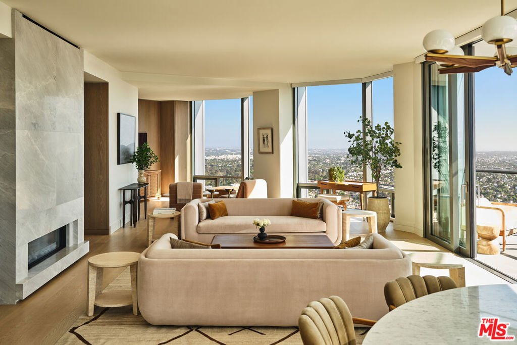 Located in the heart of Century City, the legendary glass towers at Park Elm Century Plaza, designed by world-renowned architects Pei Cobb Freed & Partners, stand as a striking testament to modern luxury. Rising 44 stories with walls of 10-foot floor-to-ceiling glass, each residence showcases sweeping panoramic views and a lifestyle defined by elegance, security, and resort-style living with access to world-renowned restaurants and retail in the Century Plaza below. Privately sited off the street with a 24-hour guard gate and valet, this dramatic approach welcomes your home. Residents enjoy a curated collection of amenities, including a resort-style pool and hot tub, a state-of-the-art fitness center, access to a full-service spa, private screening room, a library, wine storage, a game lounge, an event space, and an attentive 24-hour concierge. Every element has been envisioned to enhance life at the highest level. Residence 8D offers 2 bedrooms, 2.5 bathrooms, and approximately 1,830 square feet, complete with a private elevator lobby directly to your unit. A grand entry foyer flows into a spacious great room with a fireplace and access to a terrace, complemented by a custom Snaidero kitchen appointed with professional-grade Wolf, Sub-Zero, or Miele appliances. A private den provides versatility for work or relaxation. The primary suite features a spa-inspired bath, an expansive closet, and a private terrace, while secondary bedrooms with en-suite baths are thoughtfully positioned for comfort and privacy. The Park Elm Residences at Century Plaza is more than a home; it is an architectural landmark and an enduring expression of modern elegance just moments away from the best shopping, dining, and lifestyle Century City has to offer.