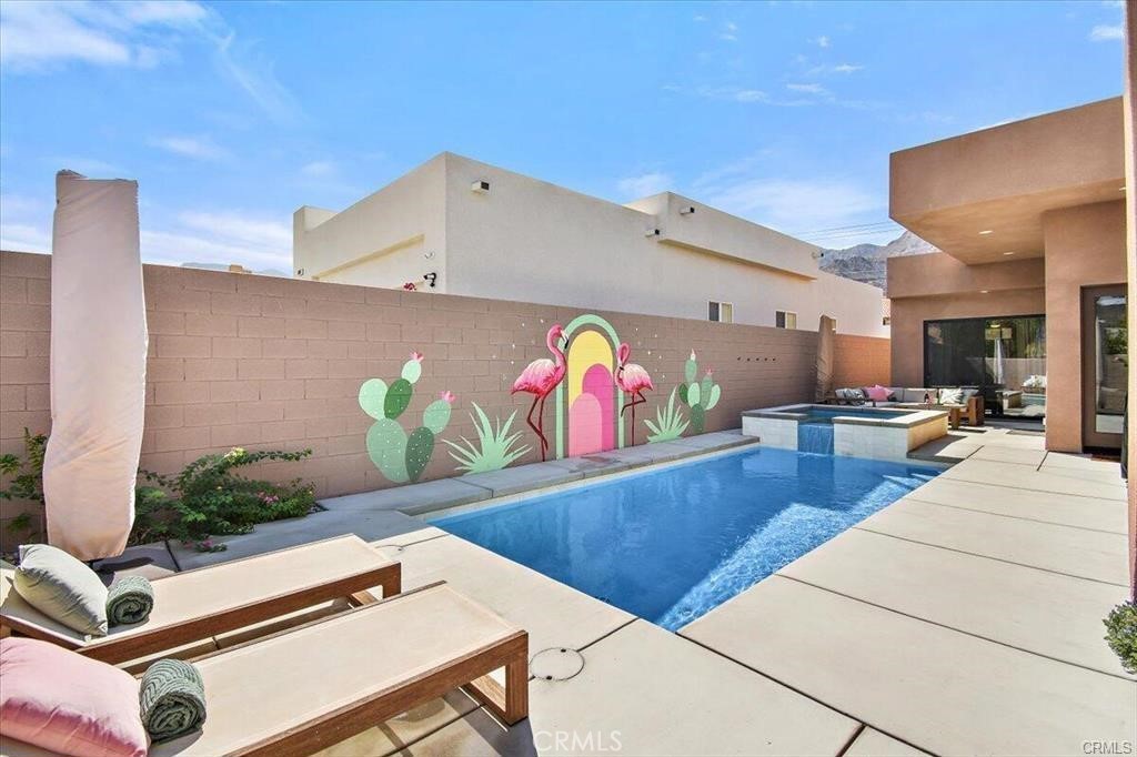 This stunning, meticulously maintained four-bedroom, two-and-a-half-bathroom home offers an open, spacious floor plan perfect for modern living. As you arrive, you'll be captivated by the charming courtyard wall. Enjoy serene, breathtaking views while lounging in your private pool and spa, conveniently located at the front of the home.
Step inside to find a beautifully decorated and fully stocked interior, ideal for a fantastic vacation. Nestled within walking distance of the world-renowned Santa Carmelita mountains, you'll have access to the best hiking and biking trails right at your doorstep.
For those who love shopping and dining, the vibrant Old Town La Quinta is just moments away, offering an array of delightful options. All you need to bring is your toothbrush—everything else is ready for you to relax and enjoy!