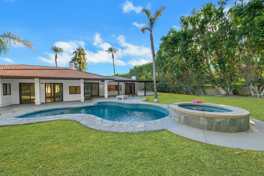 Located in the heart of Rancho Mirage, this beautifully updated home sits on a spacious half-acre corner lot designed for both comfort and entertaining. Every detail has been thoughtfully upgraded, showcasing a perfect blend of modern convenience and timeless desert elegance. The exterior features fresh paint, smart Pentair pool equipment, a Pebble Tec pool with salt system and spa, and a new patio cover complete with ceiling fans and lighting. Enjoy the ultimate outdoor experience with a built-in BBQ island featuring burners, a mini fridge, and sink, all surrounded by newly designed low-maintenance desert landscaping with relocated palms and fresh concrete work. Additional improvements include two new A/C units, a tankless water heater, new garage doors, a furnace, and a smart front door lock.Inside, the open-concept floor plan is both stylish and functional, with new countertops in the kitchen, bar, laundry, and bathrooms, updated appliances, and elegant baseboards and crown molding. The kitchen flows seamlessly into the family room centered around a cozy fireplace, while the sunken living room with wet bar and adjacent dining area provide the perfect setting for entertaining. Two expansive primary suites each offer walk-in closets and luxurious en-suite bathrooms featuring soaking tubs, separate showers, and dual vanities. A third bedroom with its own private bath offers an ideal space for guests or extended family. Additional interior updates include fresh paint, Nest smart thermostats, new tile and fixtures in the bathrooms, mirrored closet doors, sliding glass doors, and stylish light fixtures throughout.With a three-car attached garage, circular driveway, and plenty of parking and storage, this home offers the ideal balance of luxury and practicality. Perfectly located near Eisenhower Hospital, shopping, and fine dining, this Rancho Mirage retreat combines sophistication, comfort, and convenience in one exceptional package.